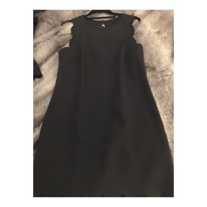 Scalloped at sleeve and bottom trim, sleeveless